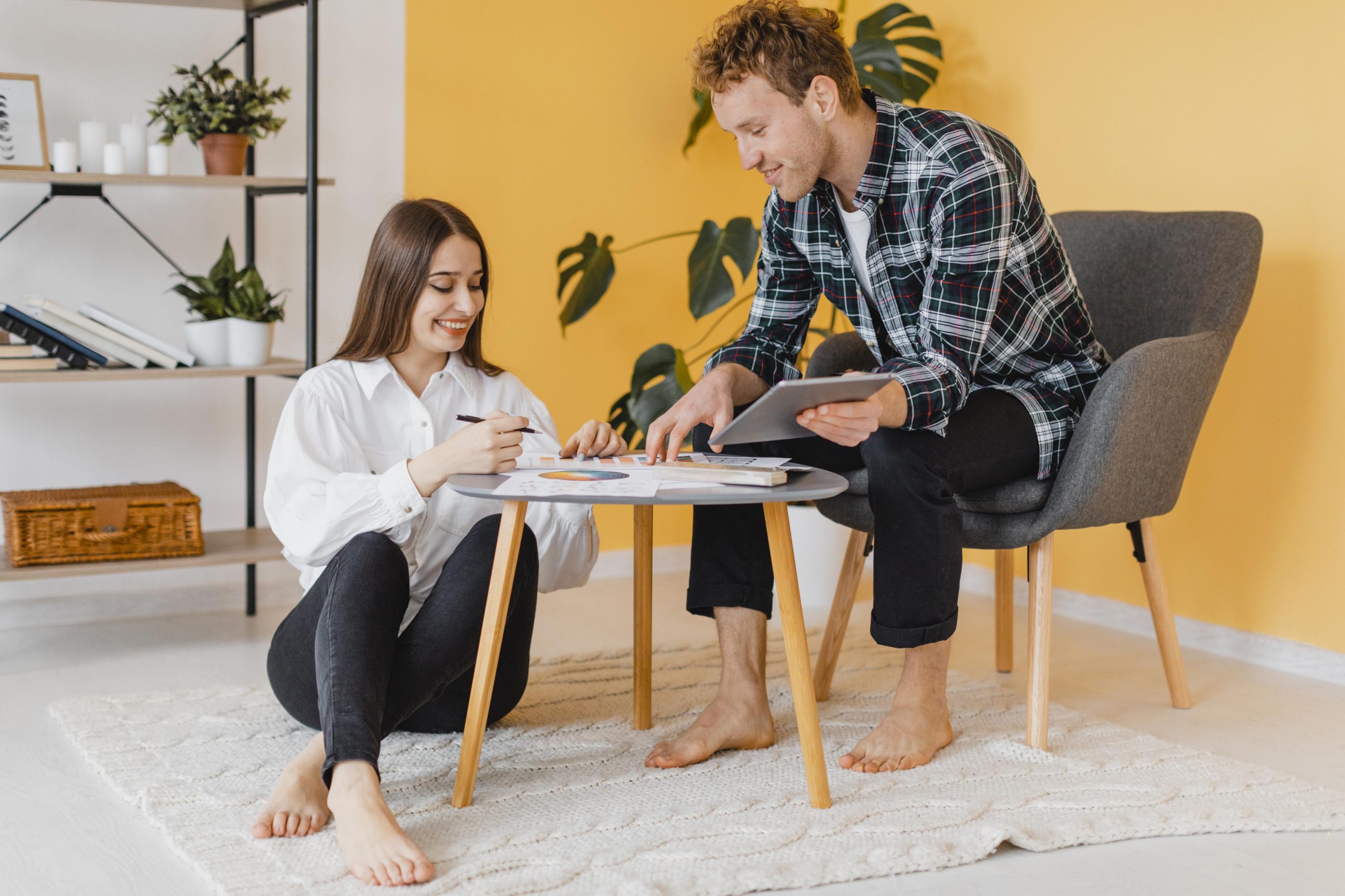 front view couple making plans together redecorate home